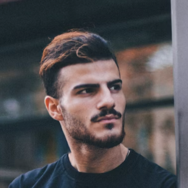 Male archer serious outdoor portrait